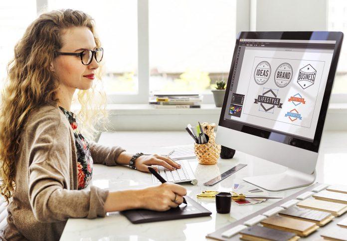 A lady working on her personal computer working on branding of website